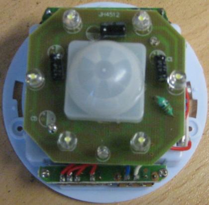 Exposed internal electronics of PIR motion sensing lamp