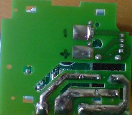 Battery contacts on the underside of the relay board