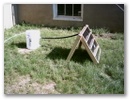 Solar water heater connected to bucket of water